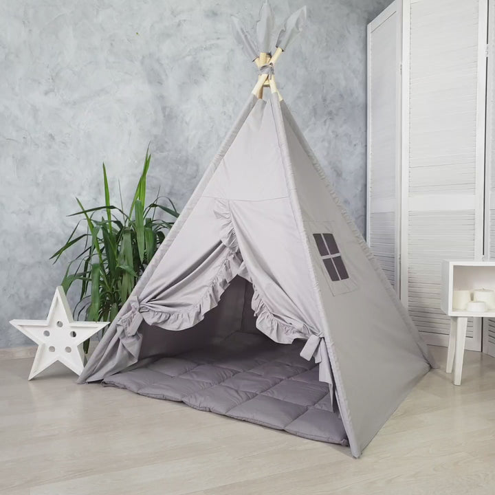 Gray minimalist kids teepee tent in nursery