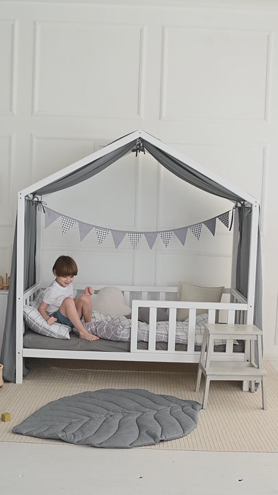 Toddler bed with sage green house canopy curtains